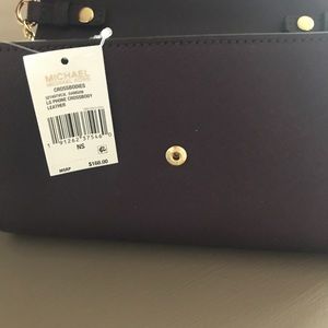 Michael Kors Bags - Purple cross body purse. Michael Kors Bags - Purple cross body purse.